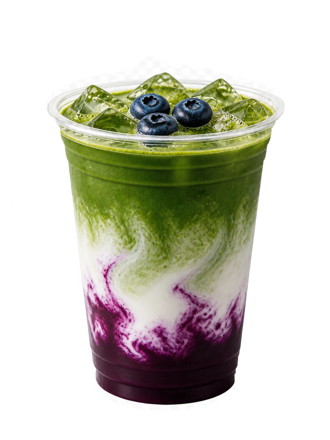 A clear cup of blueberry matcha, whole blueberries over matcha with milk and a deep blueberry purée beneath